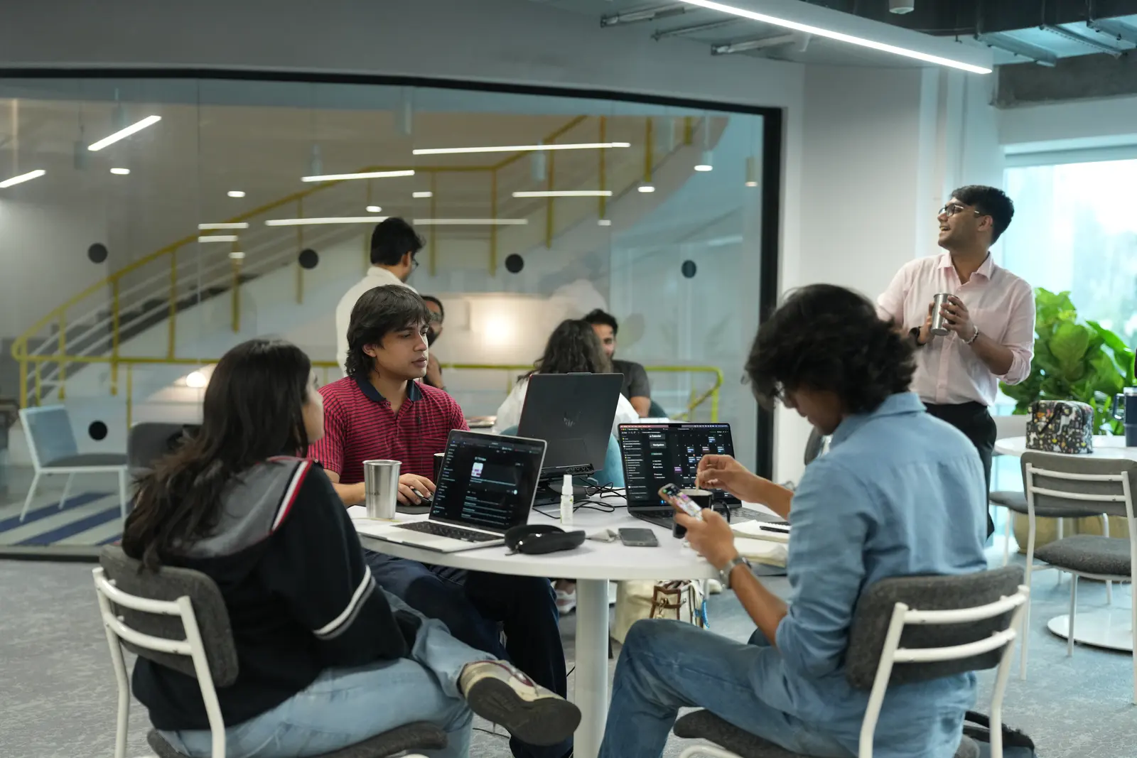 Cohort working in teams across the Mesa campus floor