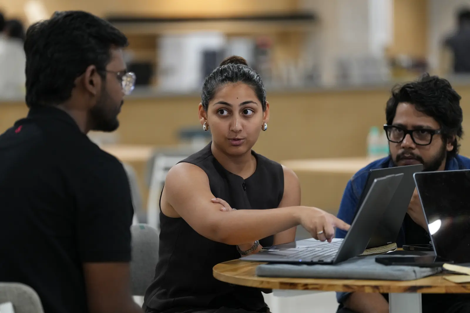 A team deep in a build session around a laptop