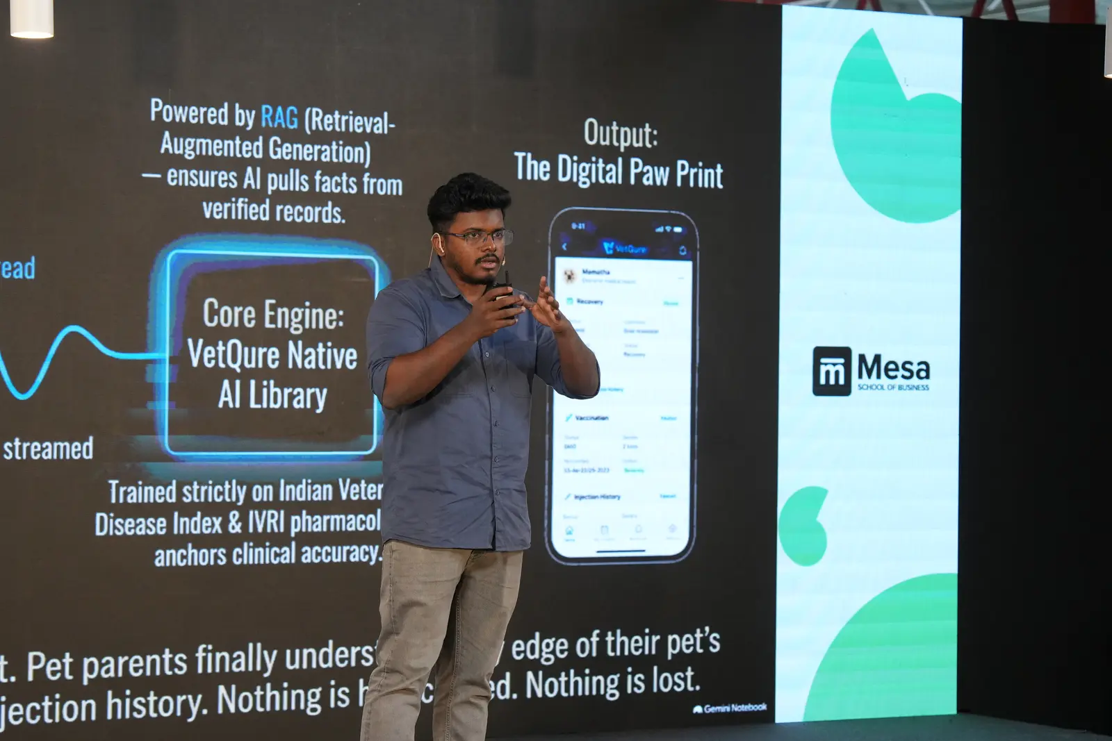 A builder demoing their product on the big screen