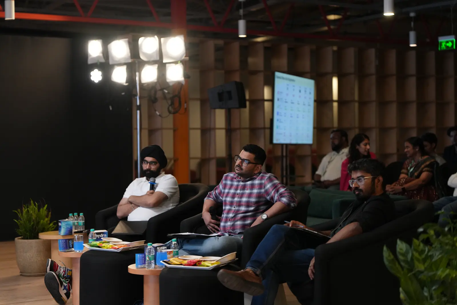 Students pitching to a panel on campus