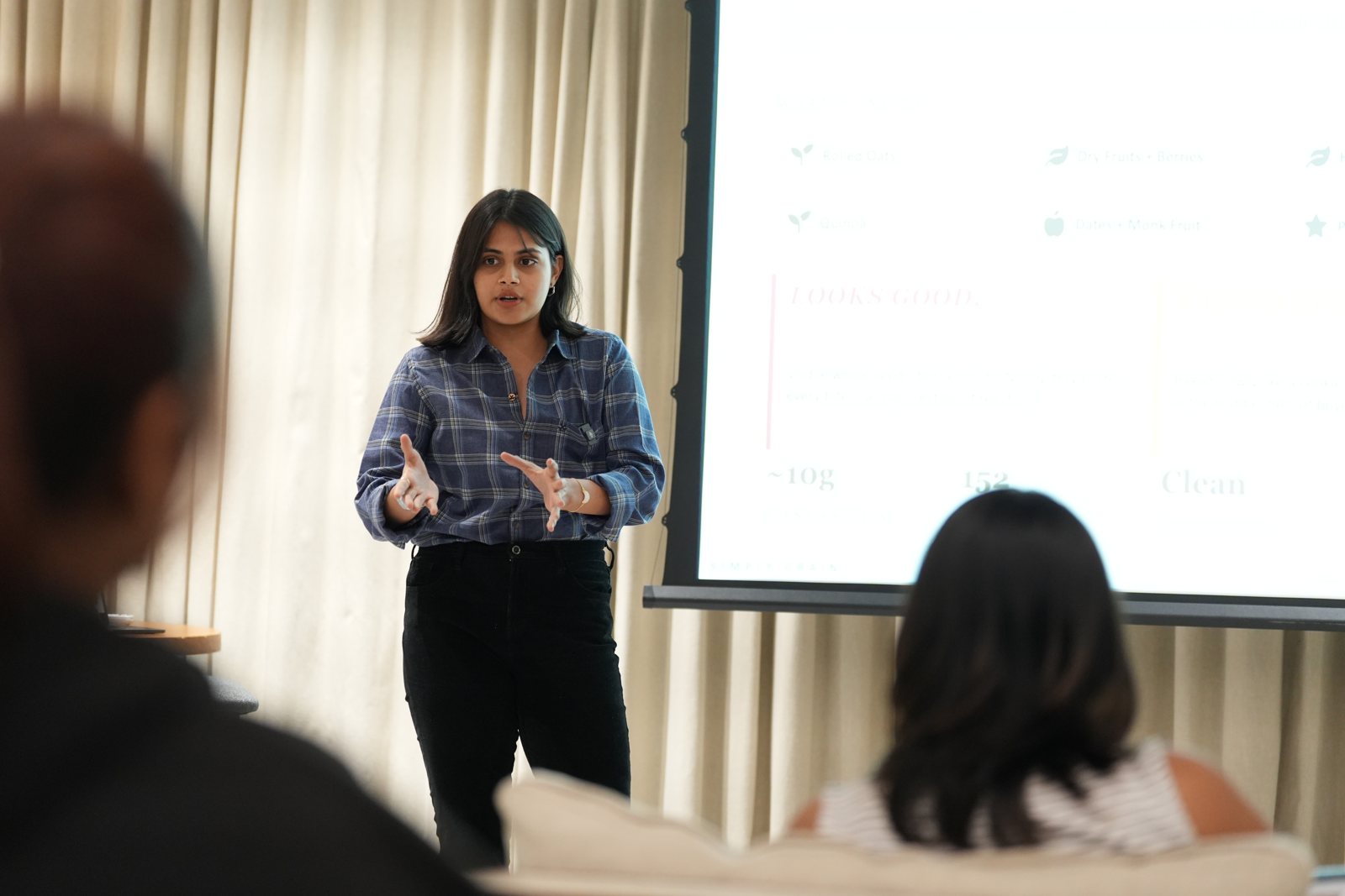 A student presenting her product to the room