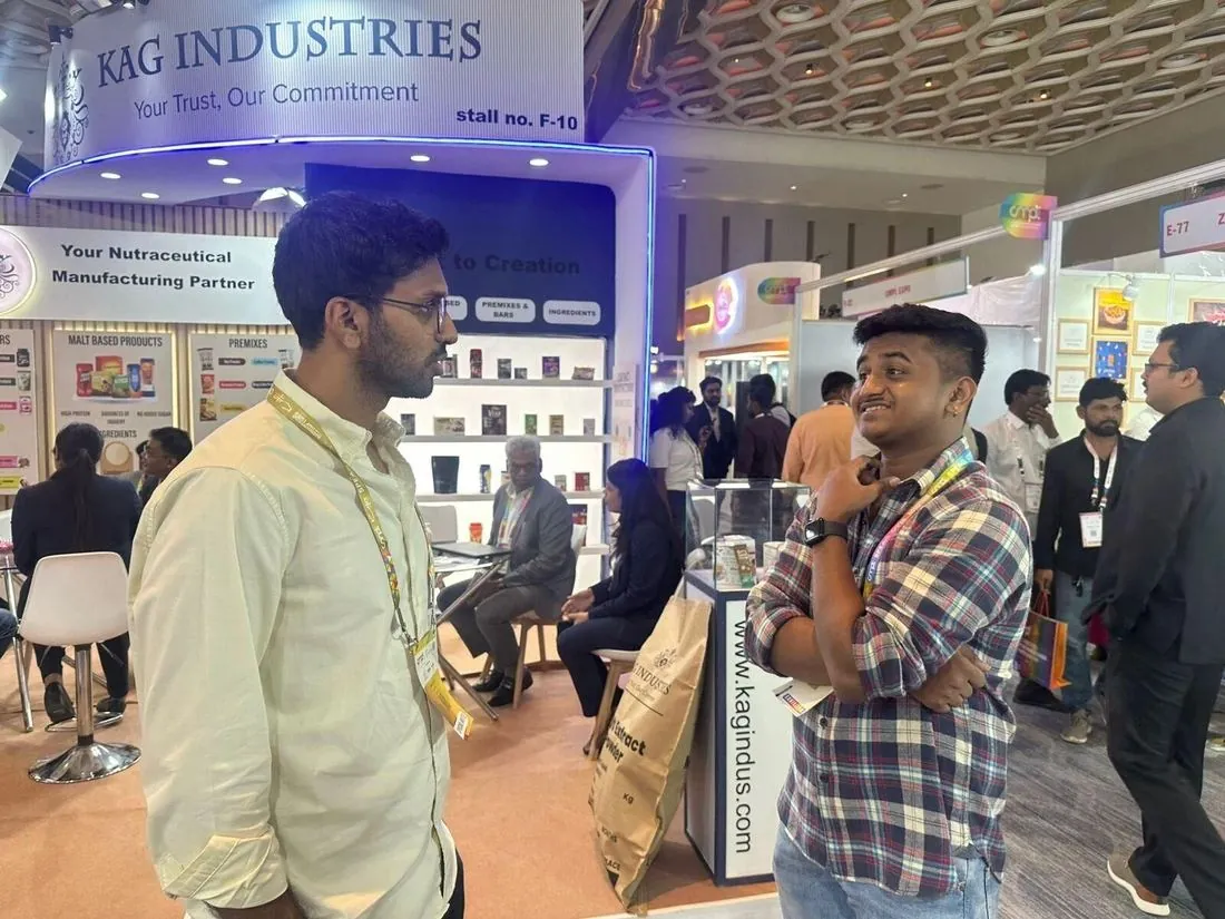 Students talking to a supplier at a trade fair