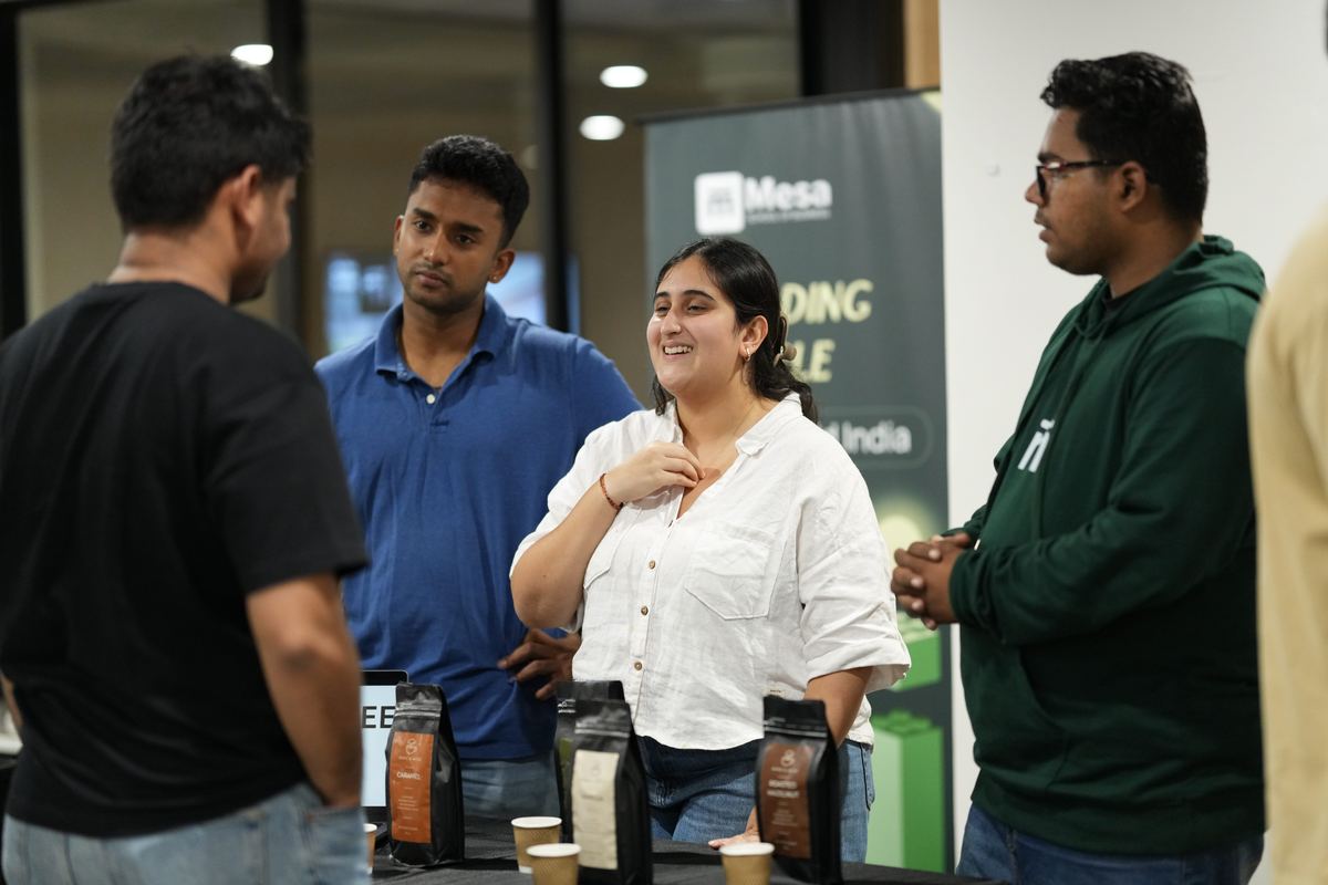 Talking to customers over a product tasting table