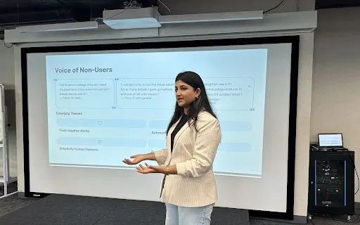 A student presenting user research on what non-users said