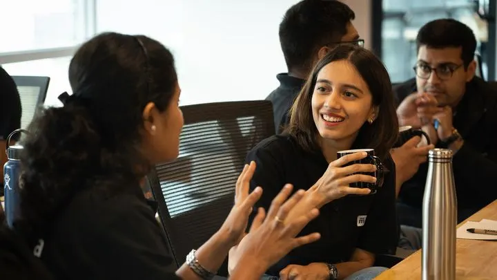 Two students in conversation about a business problem