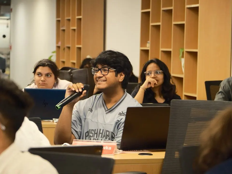 A student speaking up in class at Mesa