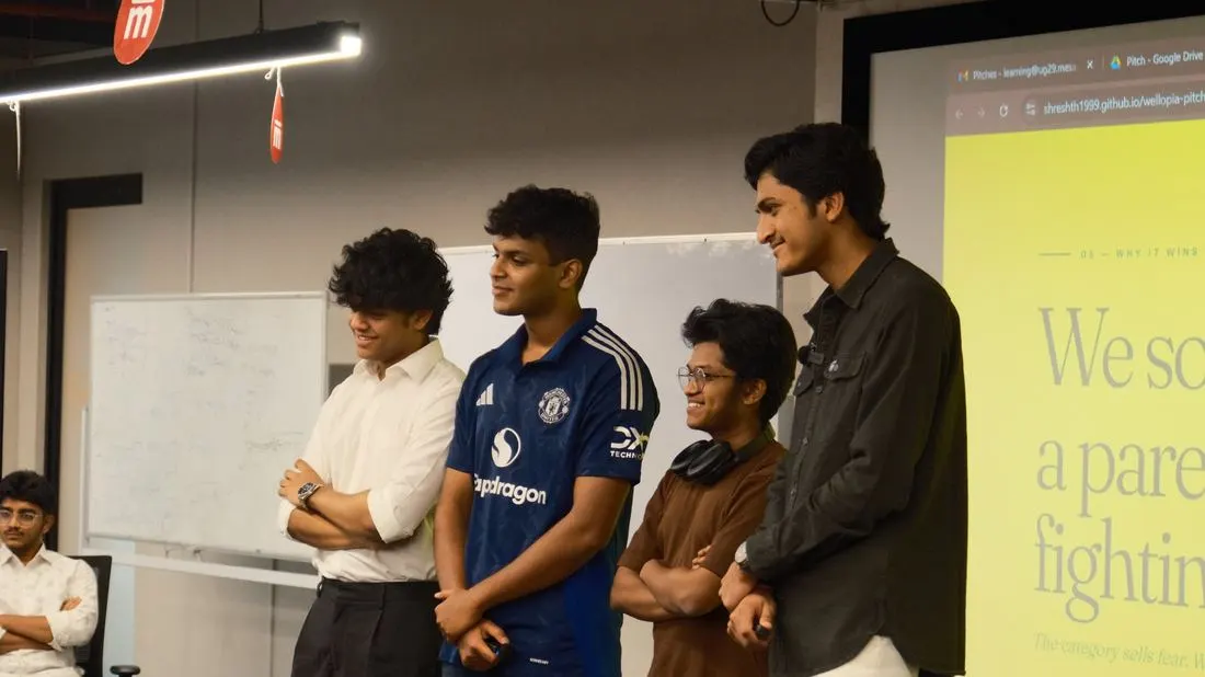 A student team presenting their pitch for a startup