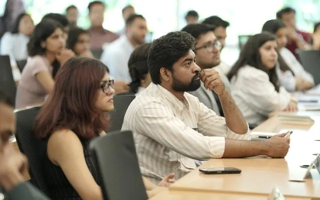 Students listening during a sector expert session