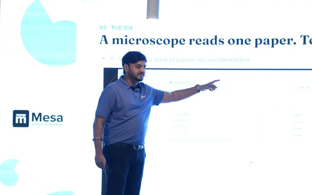 A student demoing his AI research product on stage