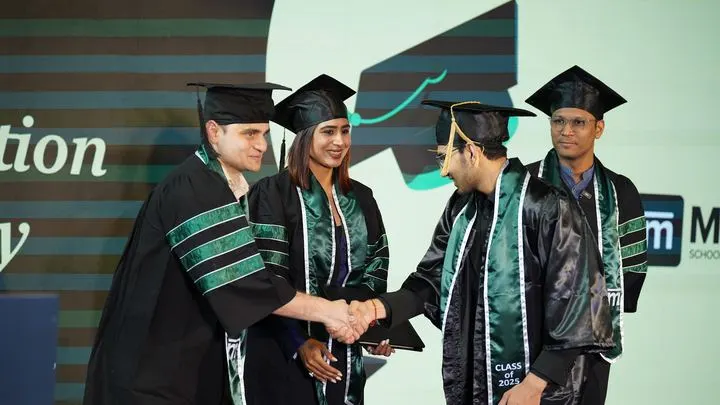 A Mesa graduate receiving his degree at the Class of 2025 graduation