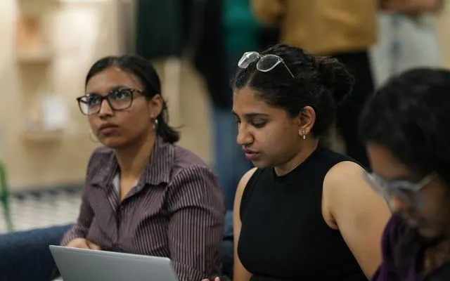 Students following a live build session on their laptops