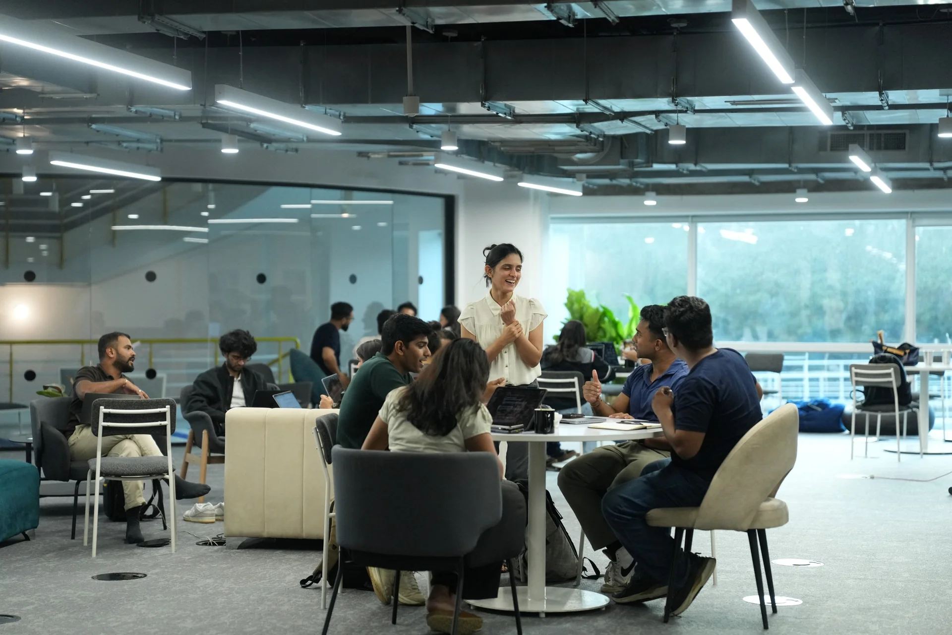Students talking over coffee in the common area