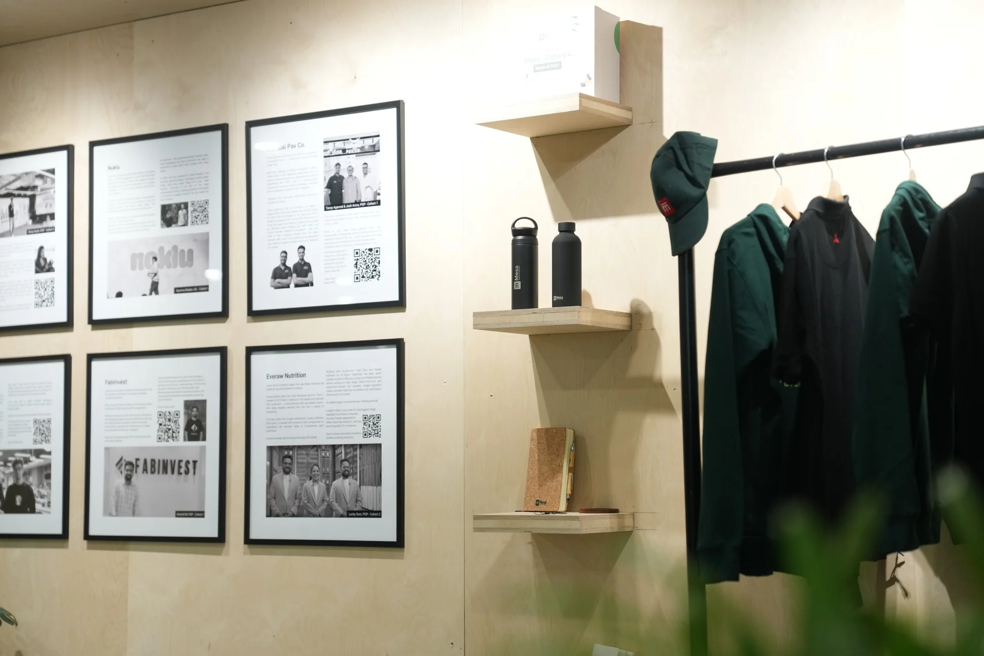 Framed Mesa photos and merchandise on the lounge wall