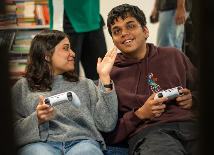 Two students playing video games at Maverion