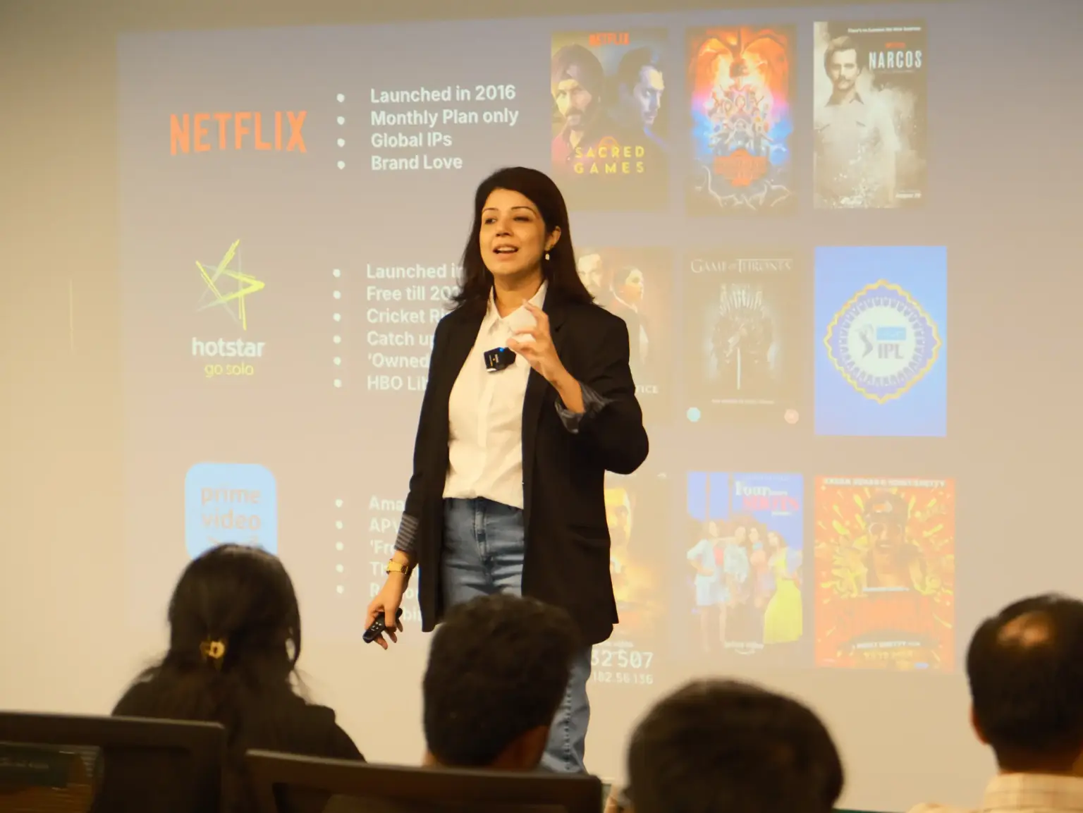 A speaker presenting a streaming-industry case slide to Mesa School of Business students