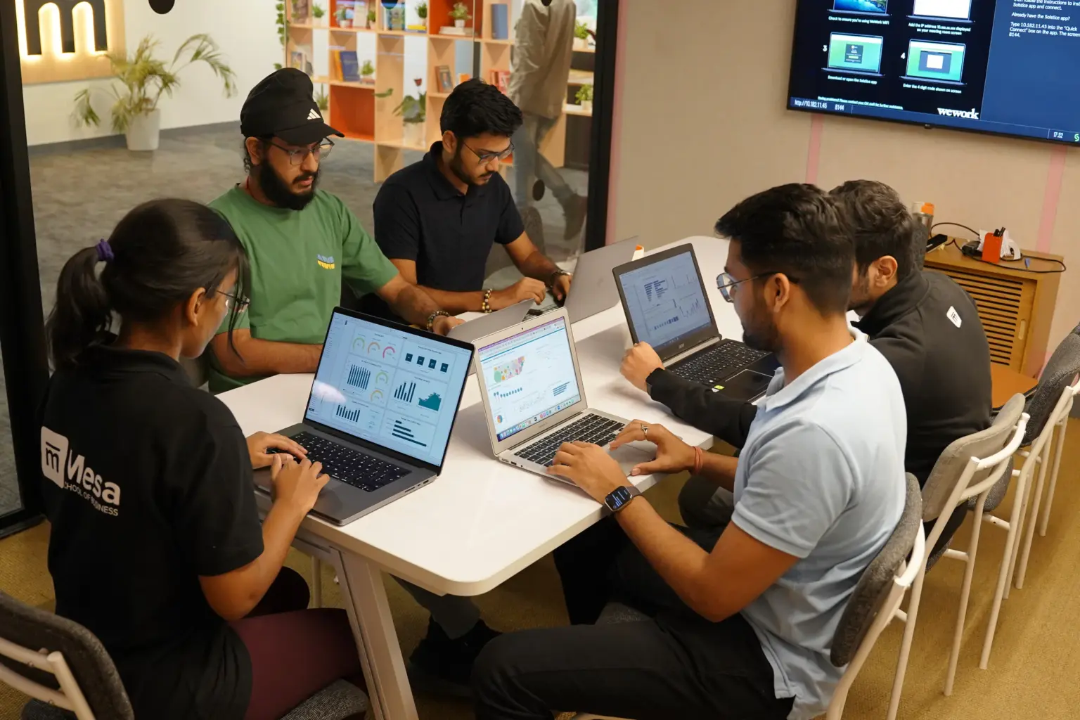 Mesa School undergraduate students working on laptops together